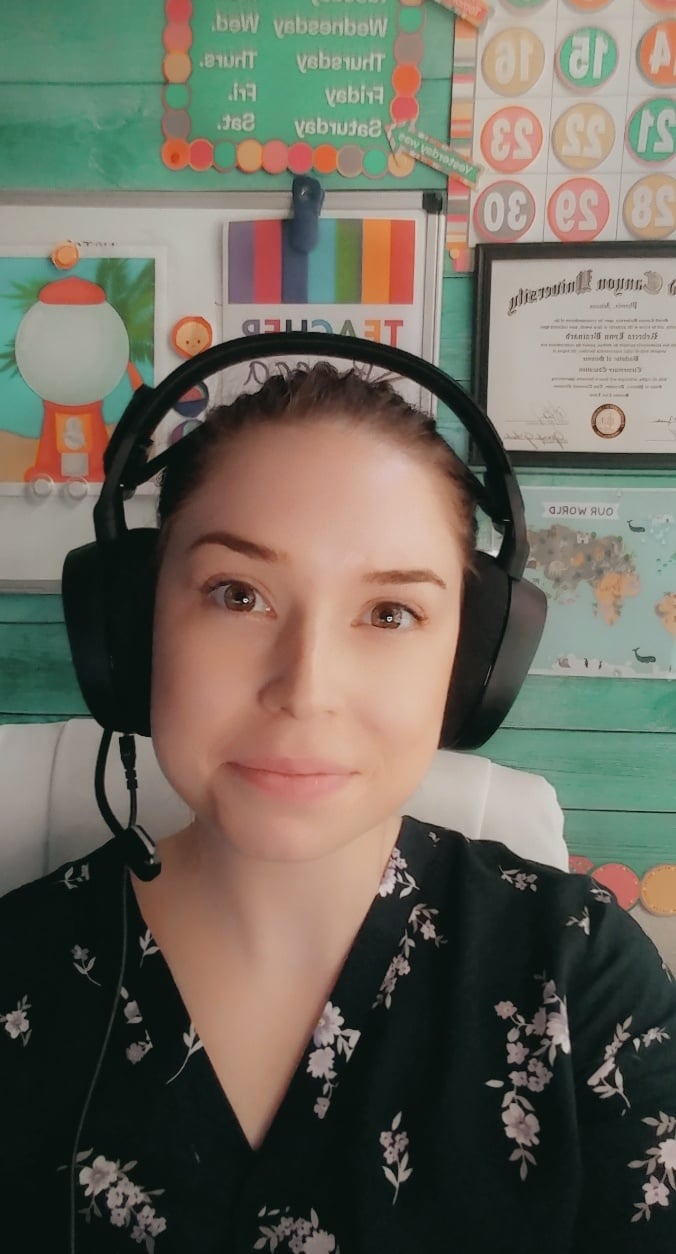 a person wearing headphones in front of a desk